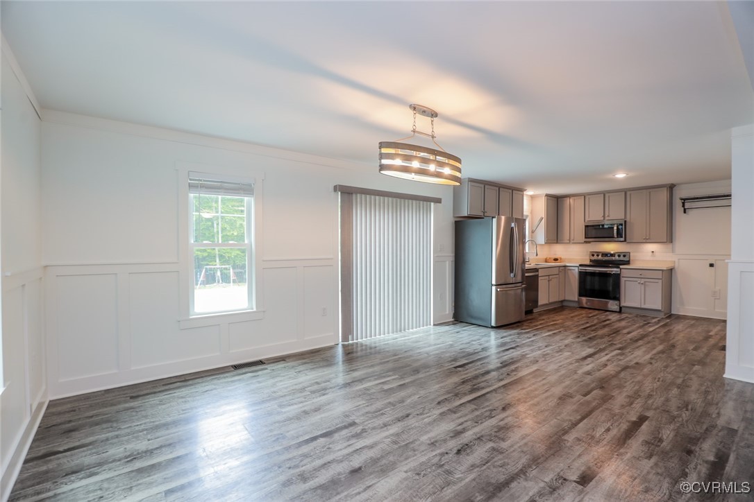 1113 Bradbury Road Moseley, VA 23120 - Photo 14 of 43 a kitchen with stainless steel appliances granite countertop a refrigerator and a stove top oven