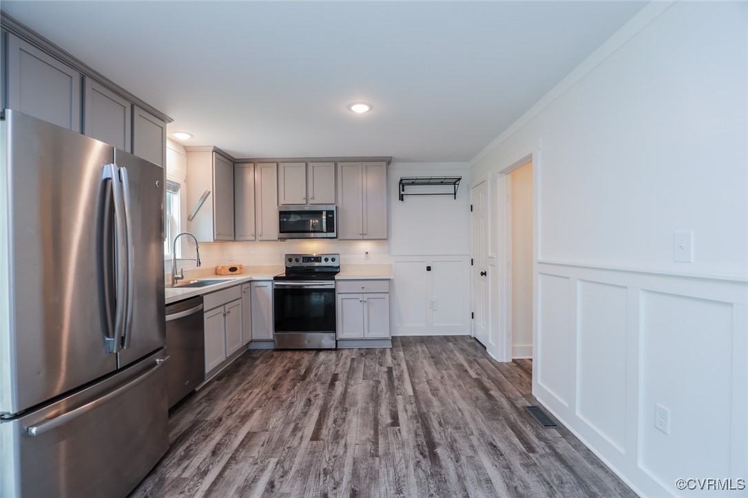 1113 Bradbury Road Moseley, VA 23120 - Photo 16 of 43 a kitchen with a refrigerator cabinets and wooden floor