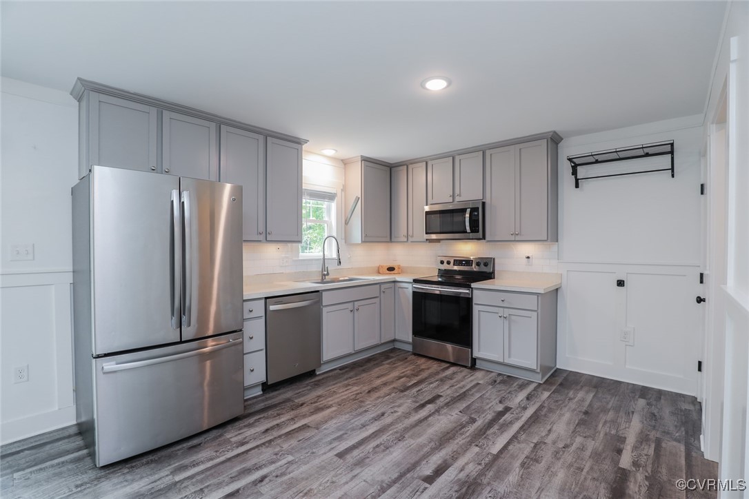 1113 Bradbury Road Moseley, VA 23120 - Photo 17 of 43 a kitchen with a refrigerator stove and wooden cabinets