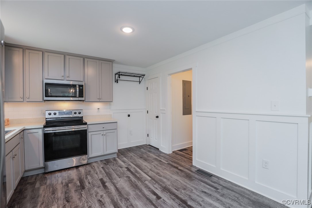 1113 Bradbury Road Moseley, VA 23120 - Photo 18 of 43 a kitchen with granite countertop white cabinets and stainless steel appliances
