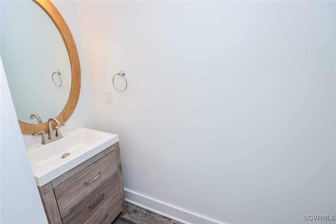 1113 Bradbury Road Moseley, VA 23120 - Photo 21 of 43 a bathroom with a sink and mirror
