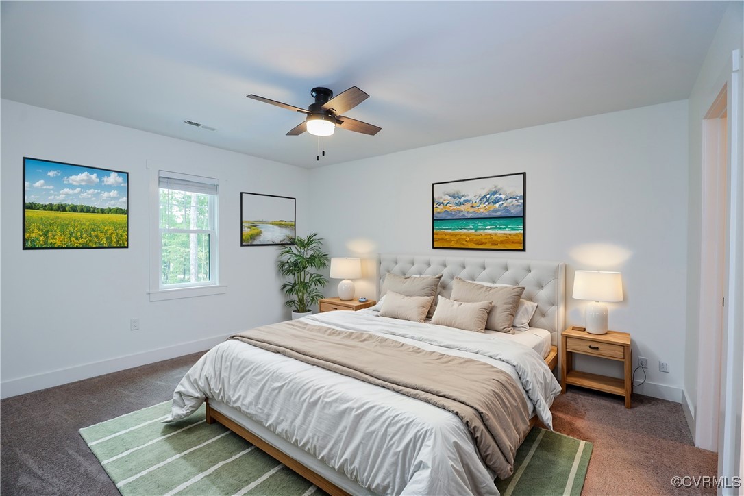 1113 Bradbury Road Moseley, VA 23120 - Photo 23 of 43 a bedroom with a bed and a chandelier