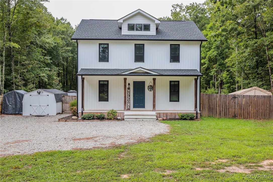 1113 Bradbury Road Moseley, VA 23120 - Photo 6 of 43 a front view of a house with a yard and garage