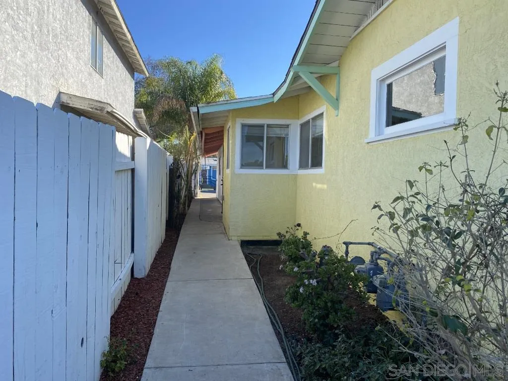 9048 Rosedale Drive Spring Valley, CA 91977 - Photo 4 of 35 a couple of flower plants in front of door