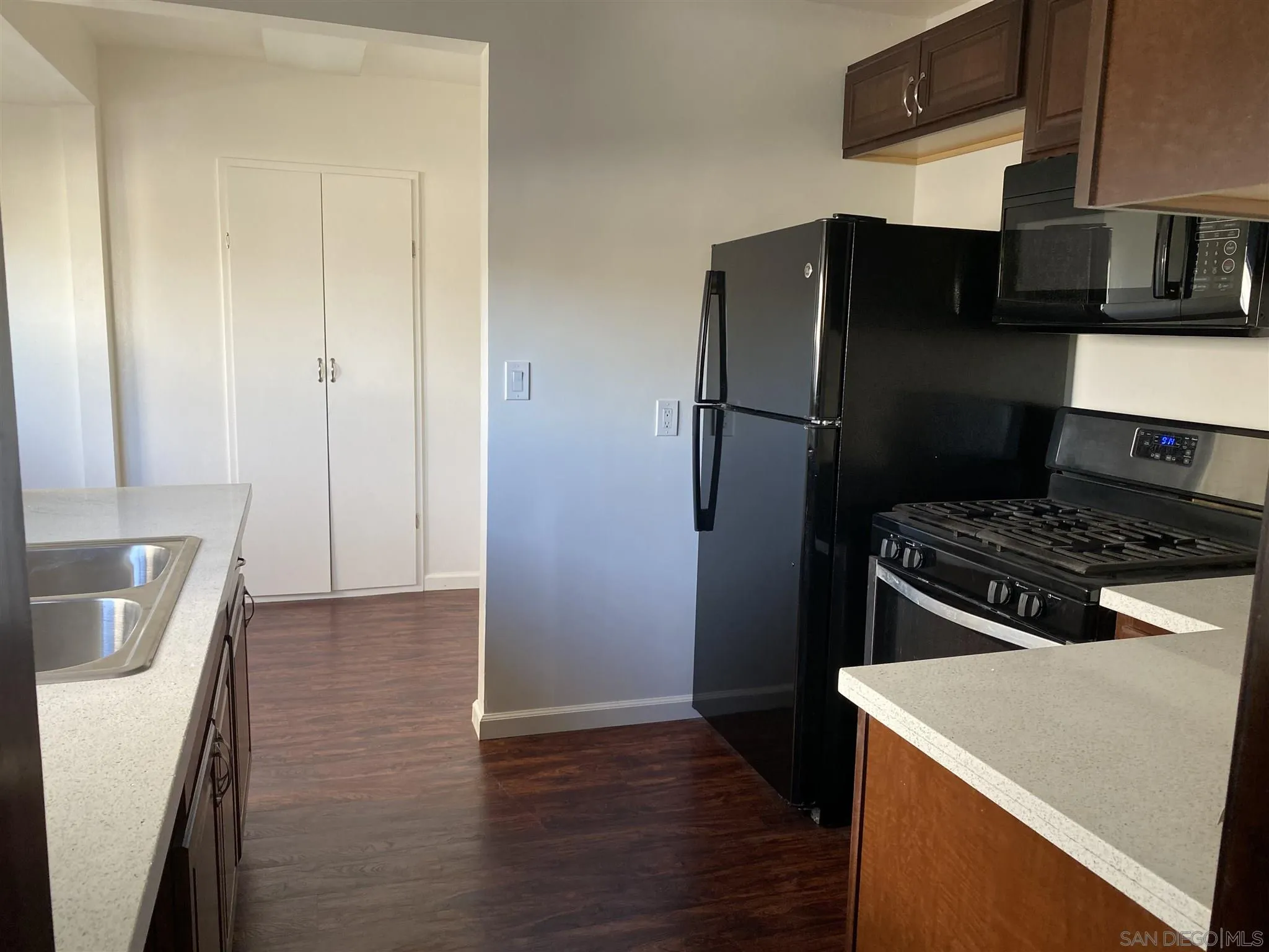 9048 Rosedale Drive Spring Valley, CA 91977 - Photo 8 of 35 a kitchen with a refrigerator stove and cabinets