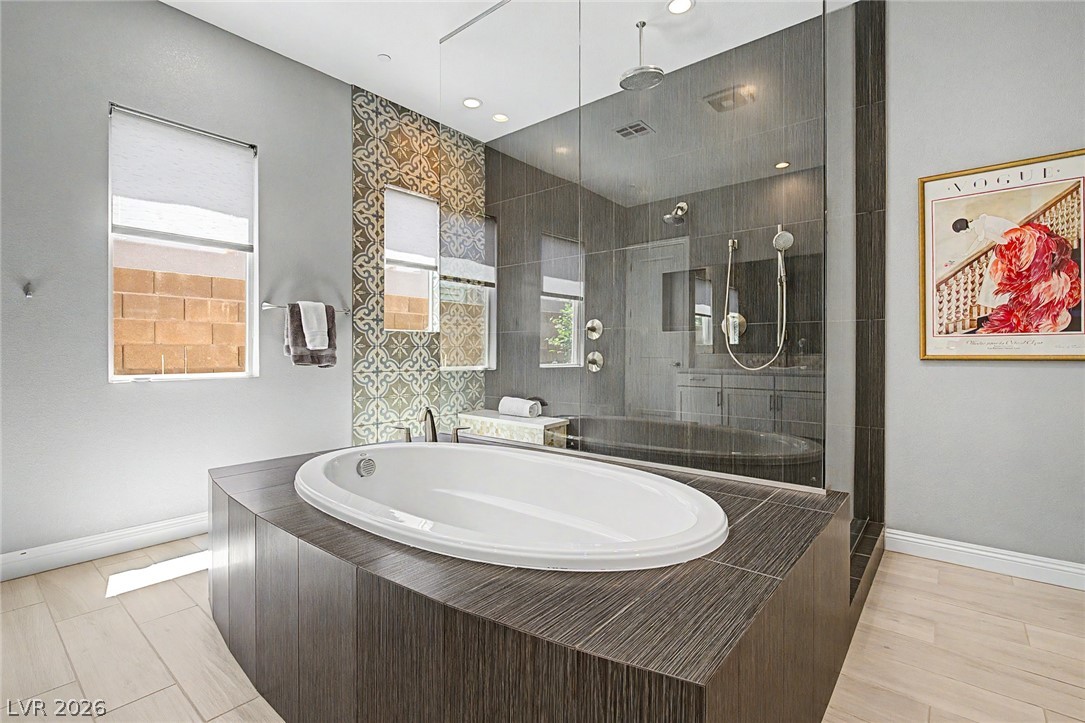 6014 Willow Ridge Court Las Vegas, NV 89135 - Photo 49 of 99 This spacious bathroom offers a relaxing retreat with modern design and thoughtful details.