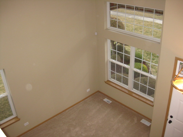 135 Treehouse Road Matteson, IL 60443 - Photo 7 of 21 a view of an empty room with a window