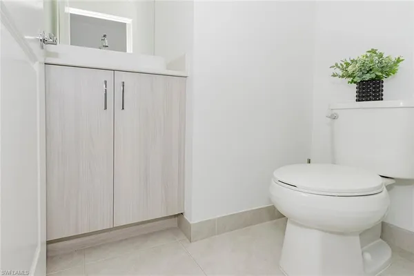 a bathroom with a toilet and a sink