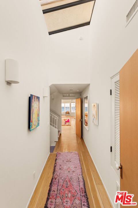23422 Malibu Colony Road, Unit 98 Malibu, CA 90265 - Photo 11 of 42 a view of a hallway with wooden floor and closet
