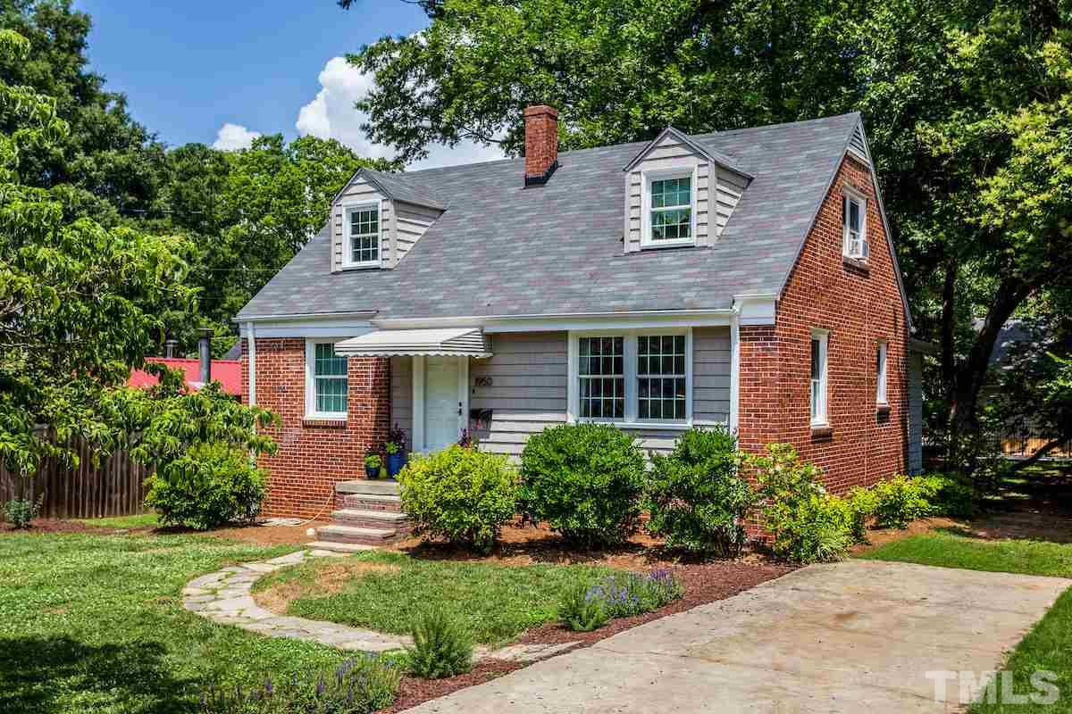1950 Bernard Street Raleigh, NC 27608 - Photo 1 of 25 a front view of a house with a yard