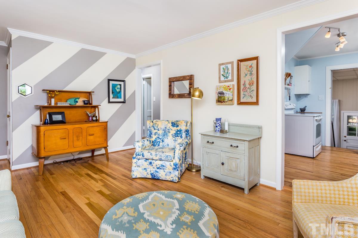 1950 Bernard Street Raleigh, NC 27608 - Photo 7 of 25 a bedroom with furniture and a wooden floor