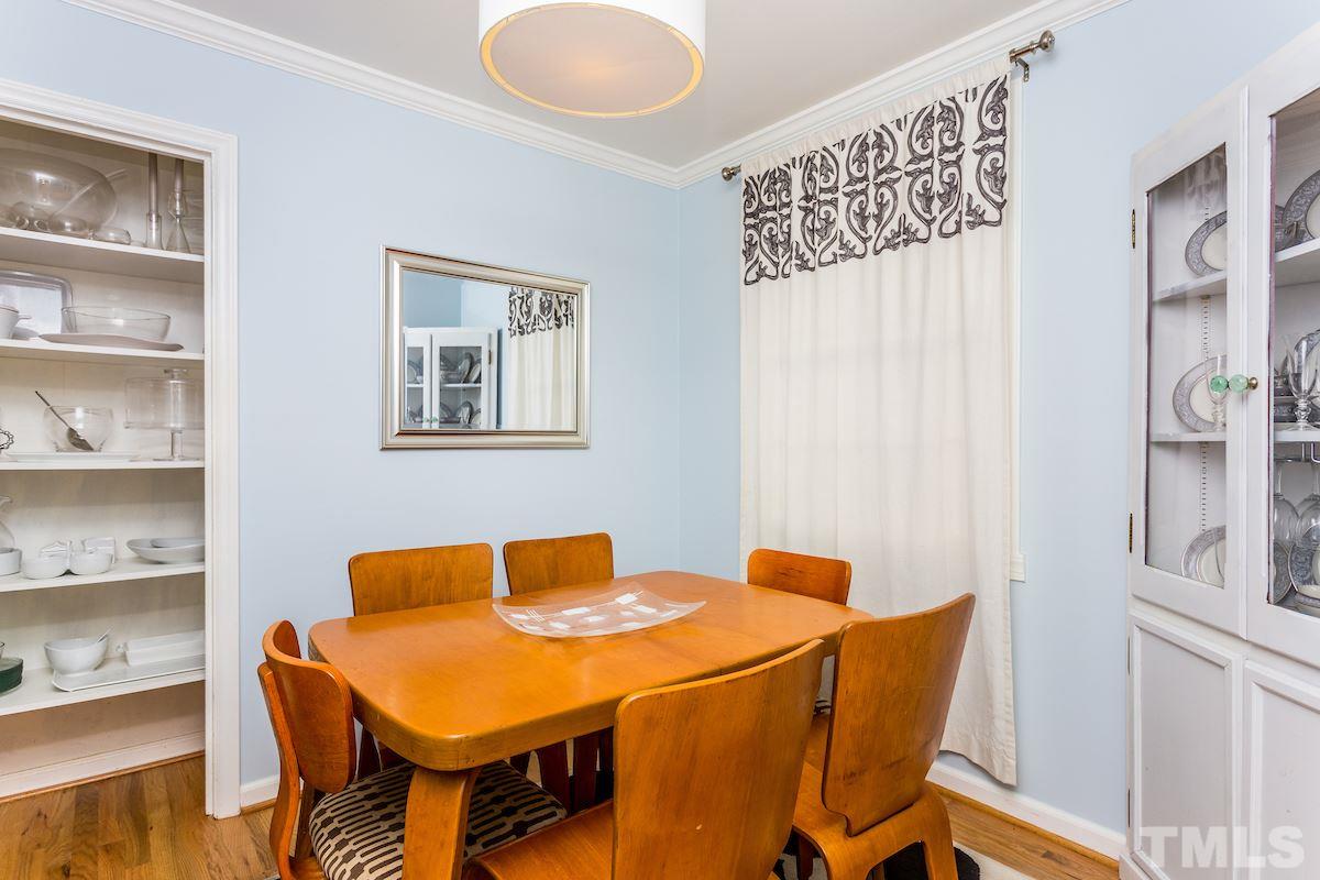 1950 Bernard Street Raleigh, NC 27608 - Photo 8 of 25 a dining room with a table and chairs