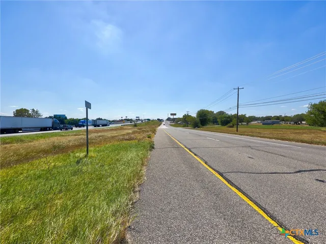 a view of a road with a yard