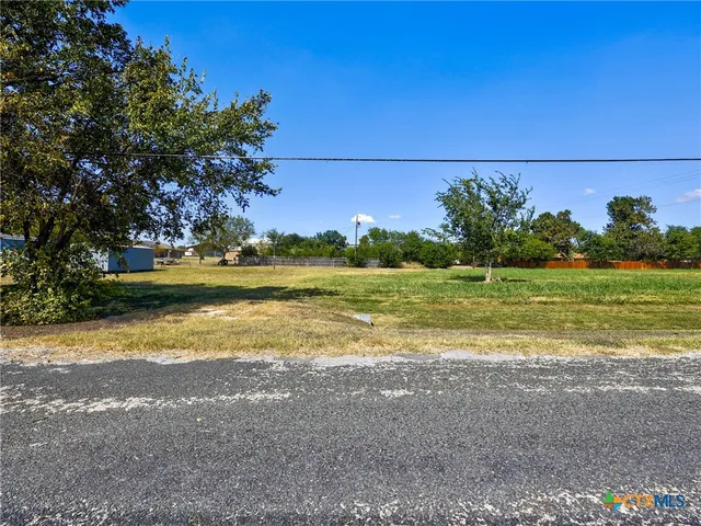 a view of a lake with a big yard