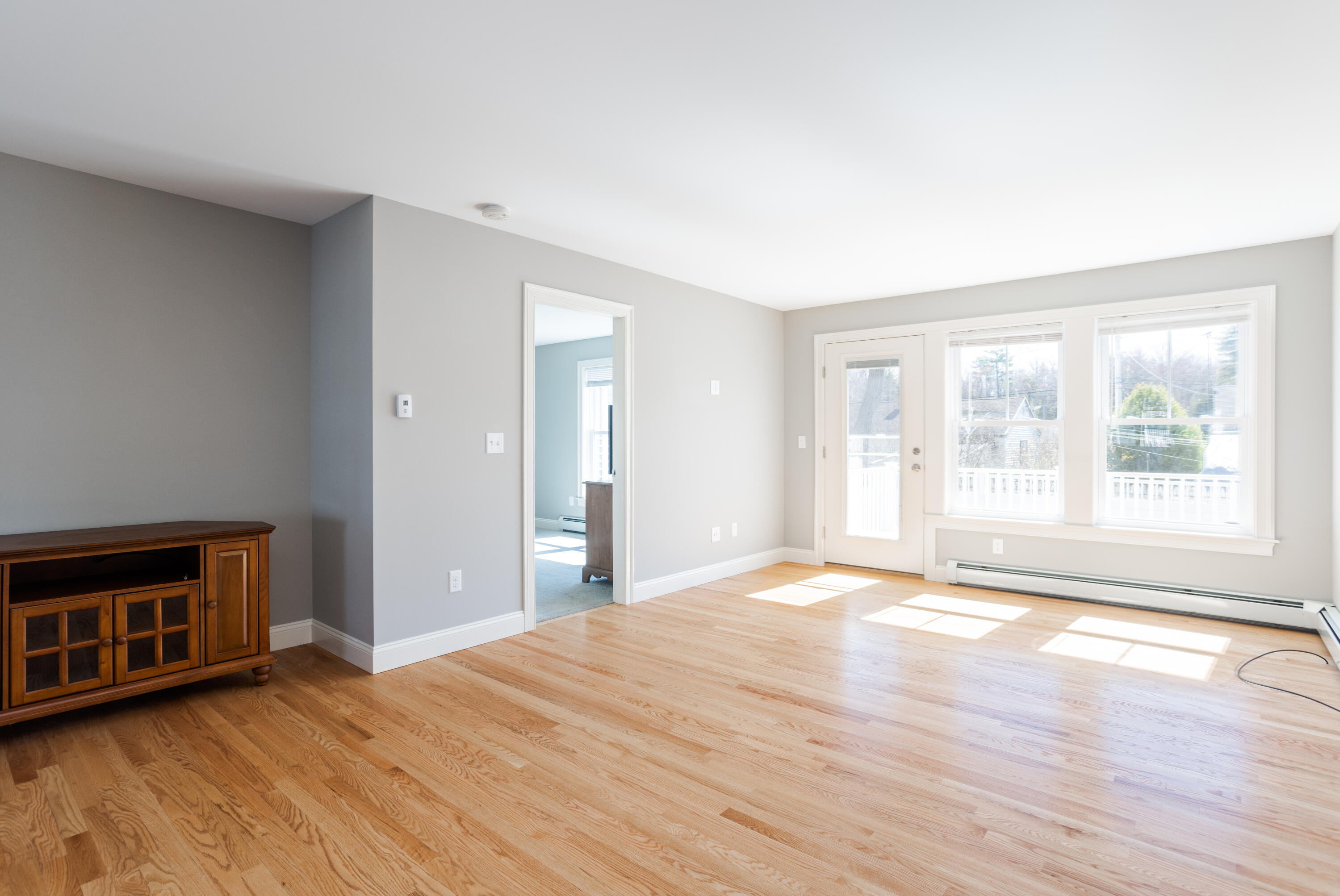4 Levi Lane, Unit 103 Biddeford, ME 04005 - Photo 8 of 34 living room w/door to deck