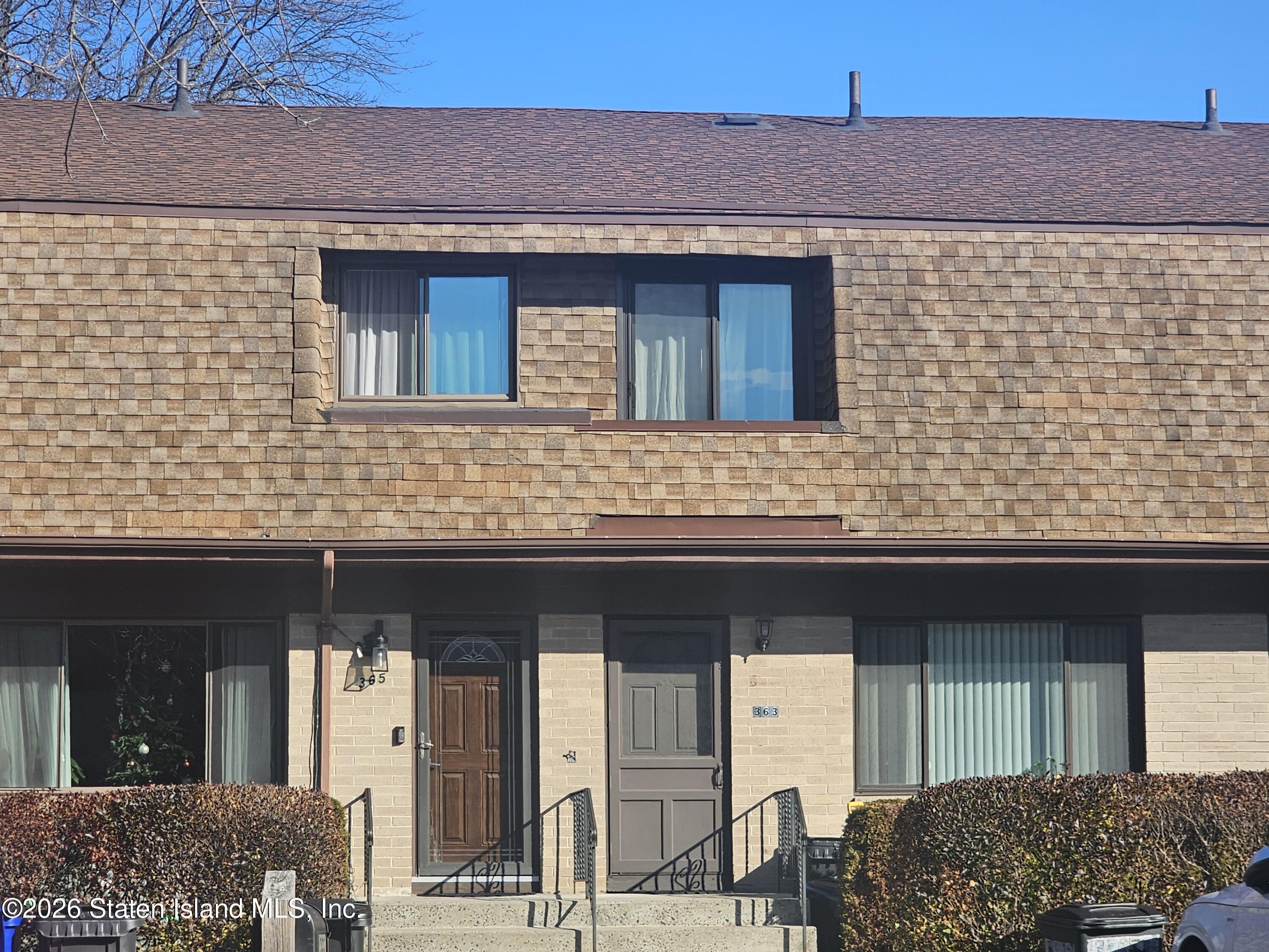 363 Windham Loop Staten Island, NY 10314 - Photo 2 of 3 a brick house with a outdoor space