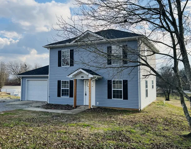 a house with trees in the background