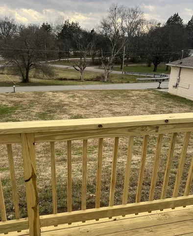 a view of a swimming pool with a yard