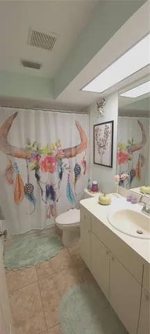 a room with a sink and a mirror