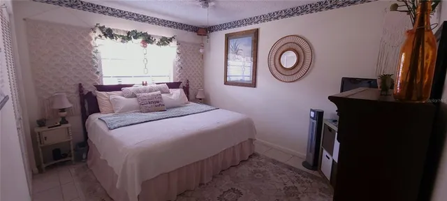 a bedroom with a bed and a closet