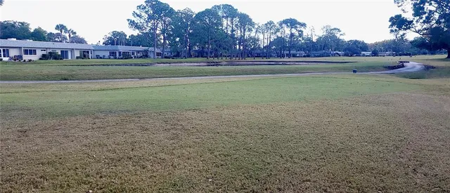 a view of big yard next to a house