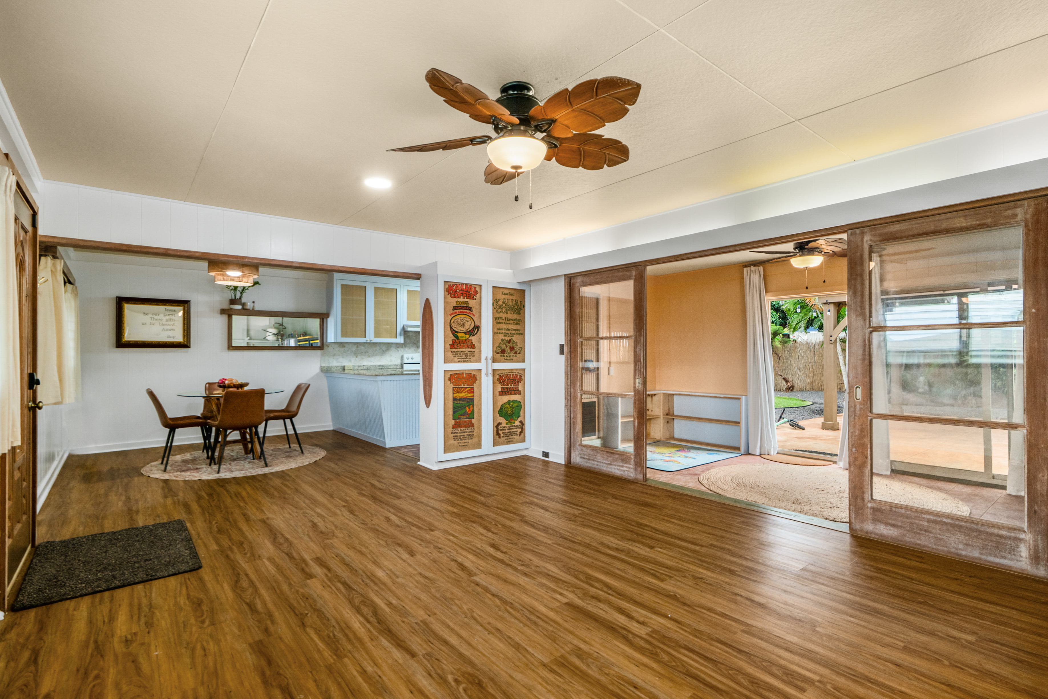 9639 Maule Road Waimea, HI 96796 - Photo 11 of 29 a living room with furniture and a floor to ceiling window