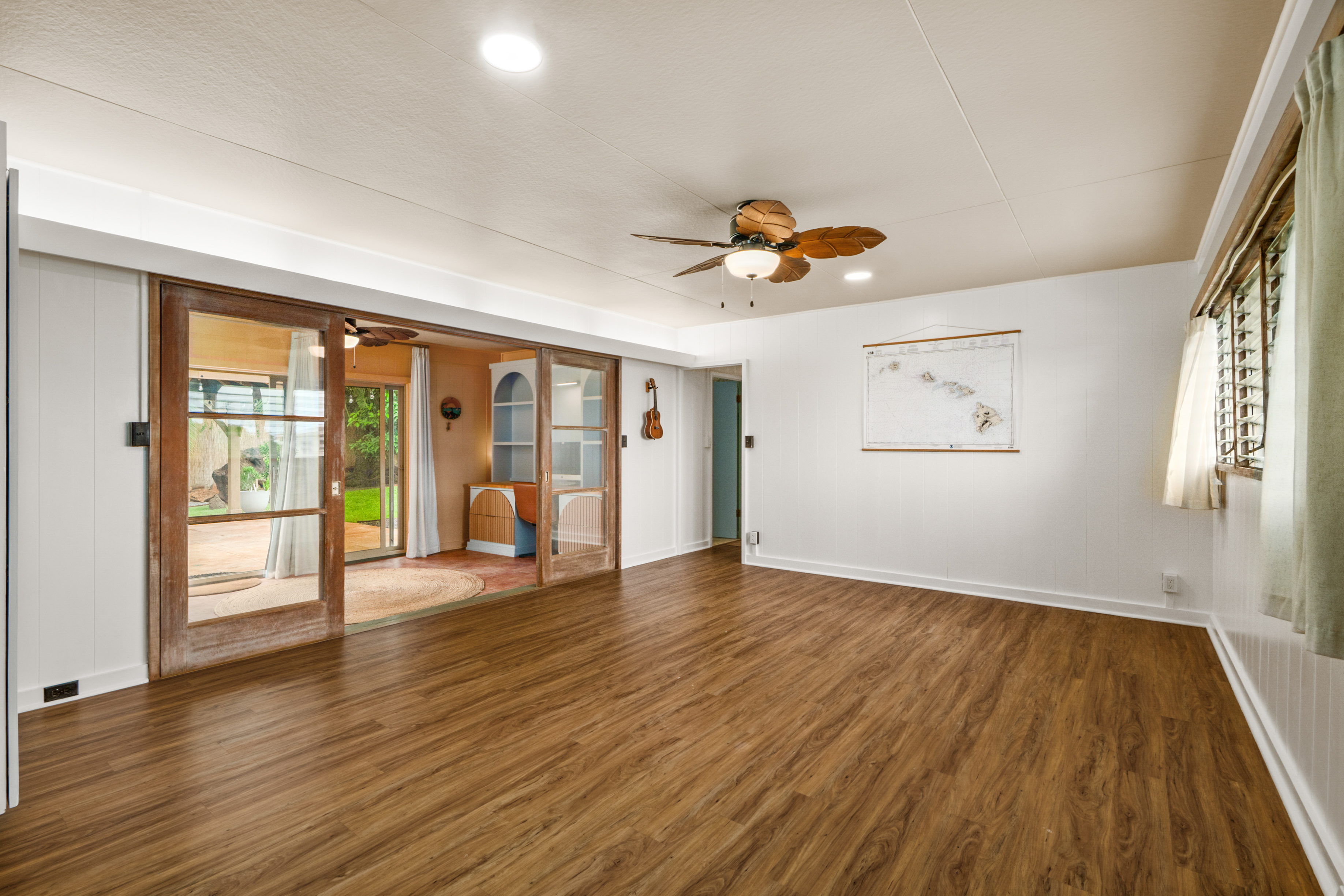 9639 Maule Road Waimea, HI 96796 - Photo 12 of 29 an empty room with wooden floor and windows