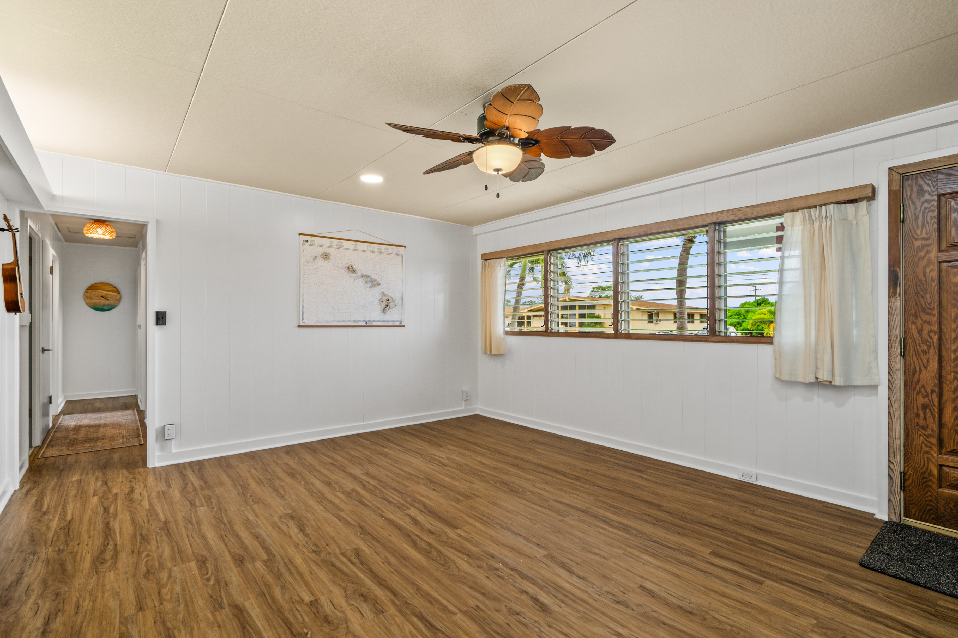 9639 Maule Road Waimea, HI 96796 - Photo 13 of 29 a view of an empty room with wooden floor and a window