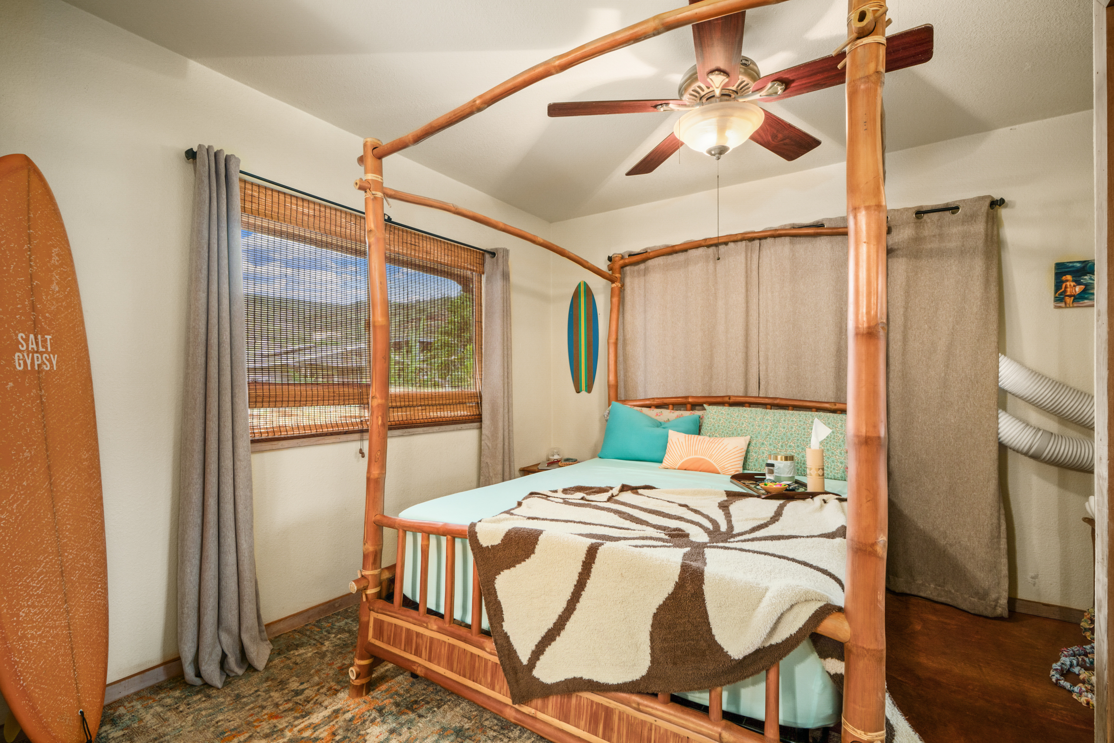 9639 Maule Road Waimea, HI 96796 - Photo 26 of 29 a bed sitting in a bedroom next to a window