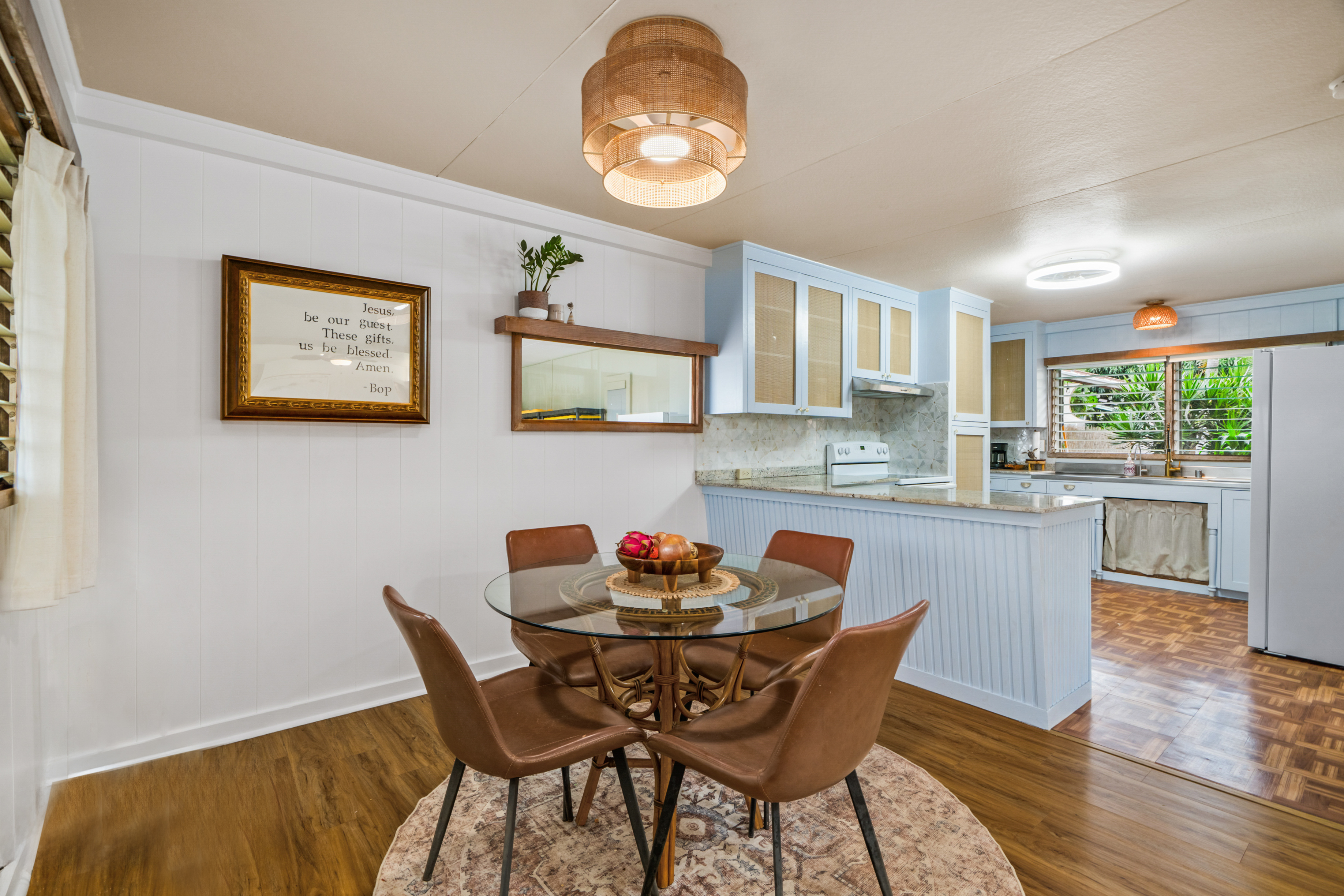 9639 Maule Road Waimea, HI 96796 - Photo 3 of 29 a dining room with furniture a window and wooden floor