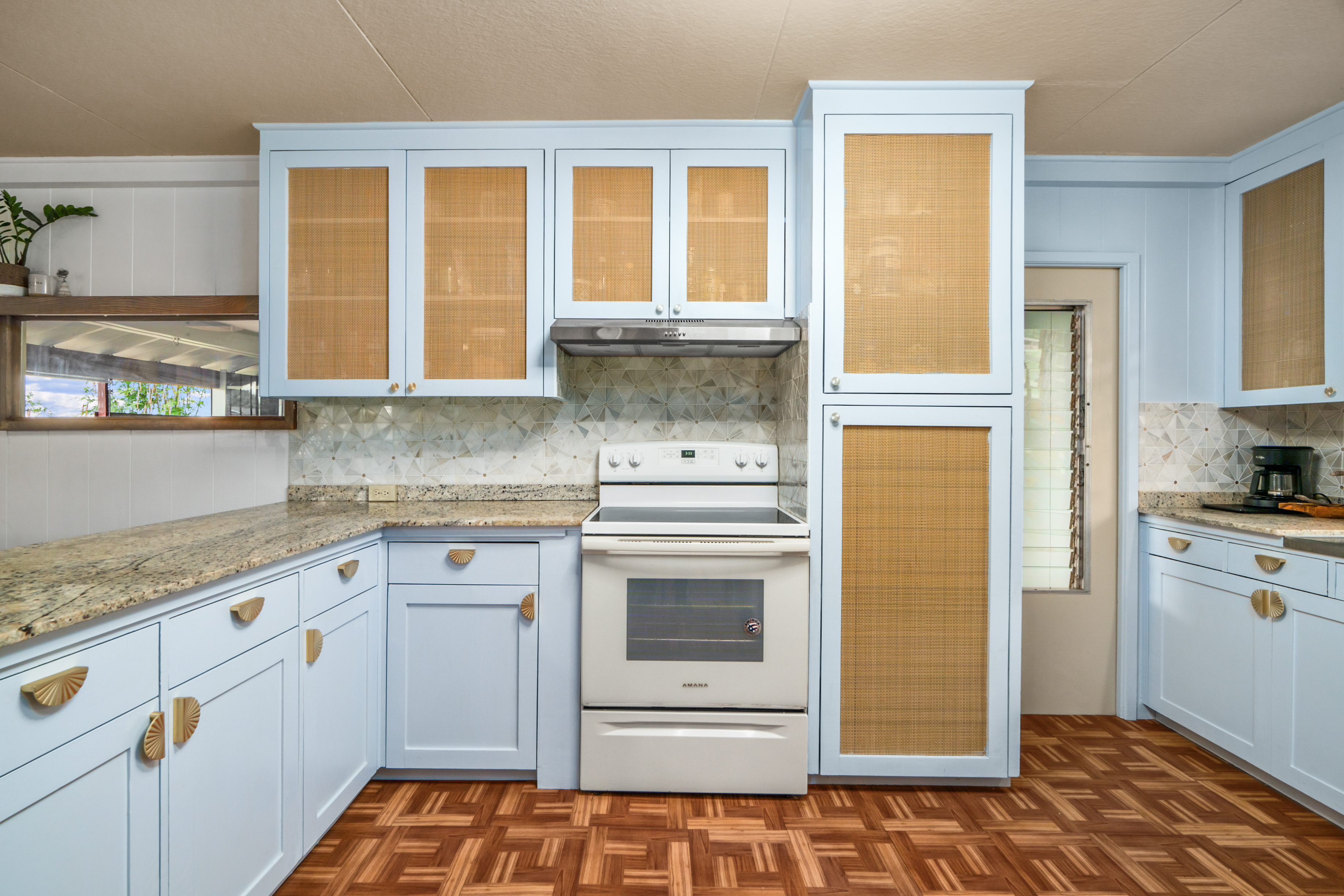 9639 Maule Road Waimea, HI 96796 - Photo 7 of 29 a kitchen with granite countertop white cabinets and white appliances