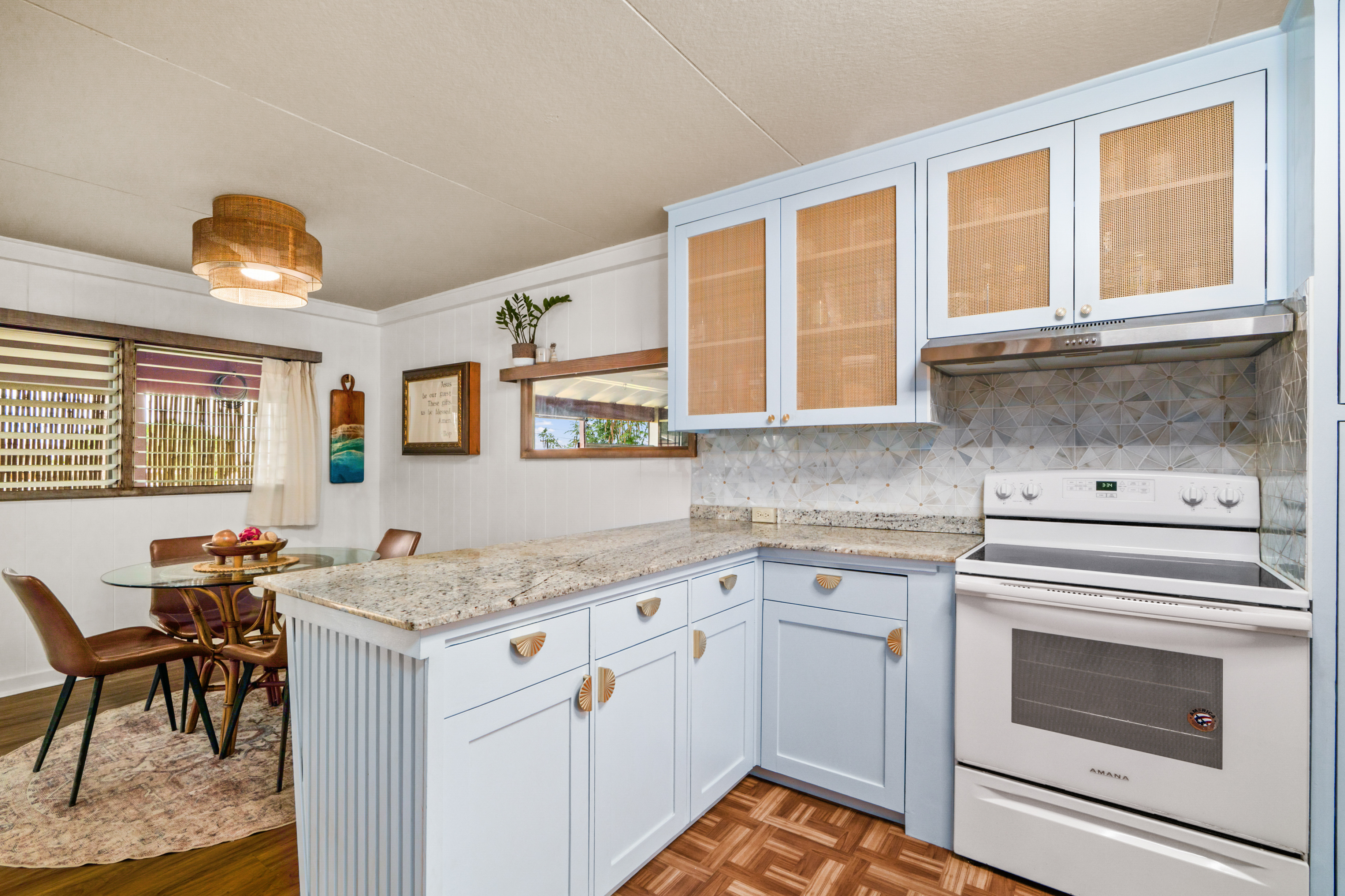 9639 Maule Road Waimea, HI 96796 - Photo 8 of 29 a kitchen with a stove a sink and a refrigerator