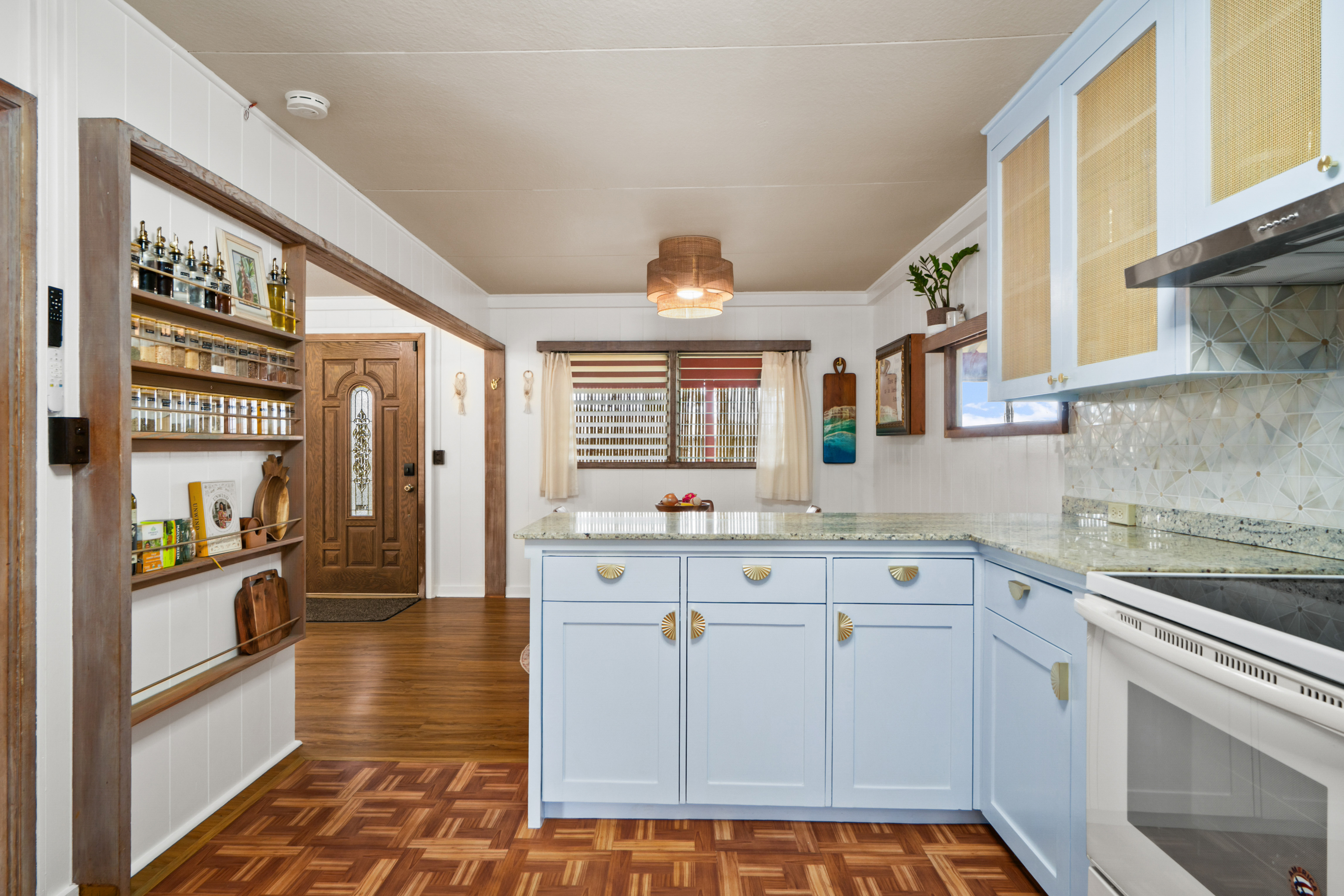 9639 Maule Road Waimea, HI 96796 - Photo 9 of 29 a kitchen with stainless steel appliances a stove a sink and a refrigerator