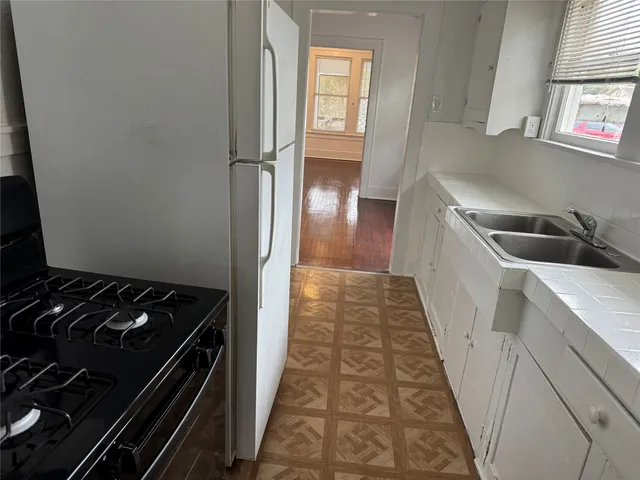 a kitchen with a stove and a refrigerator