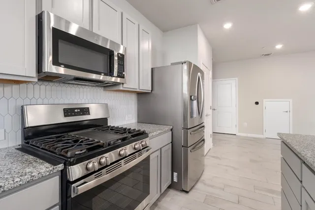 a bathroom with a sink a mirror and shower