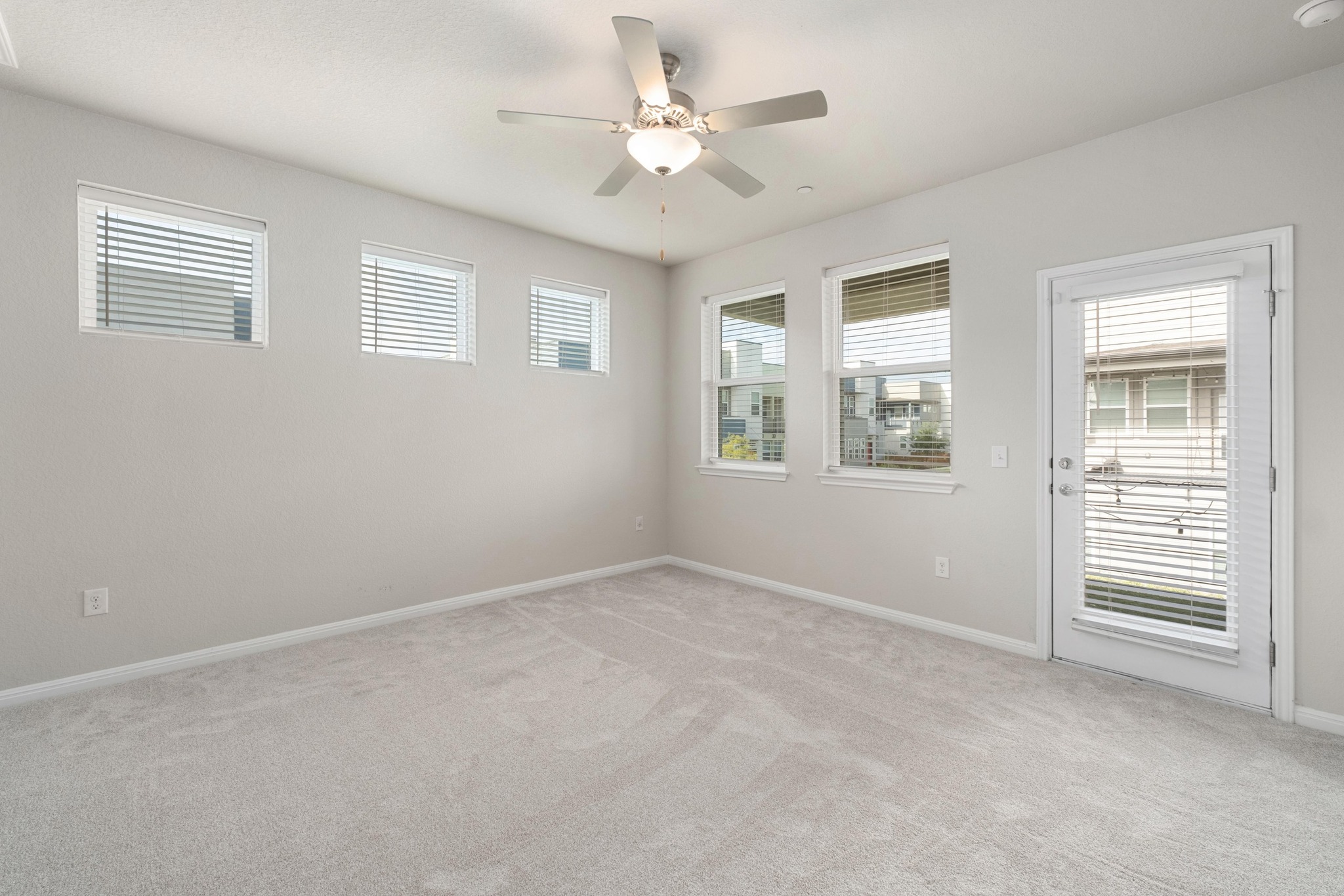 9015 Cattle Baron Path, Unit 1905 Austin, TX 78747 - Photo 14 of 40 a view of an empty room with a window