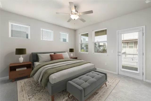 an empty room with a ceiling fan and a window