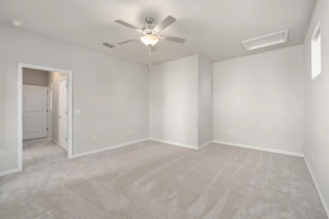 a view of a patio with a table and chairs