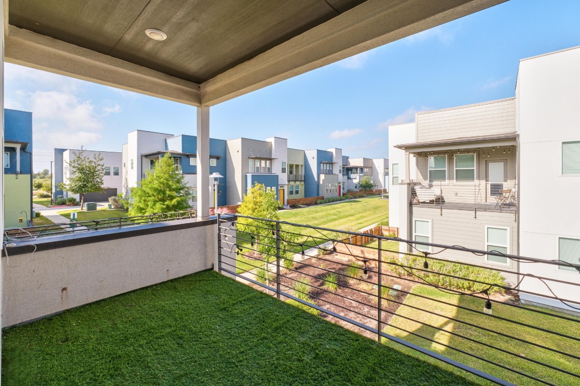 9015 Cattle Baron Path, Unit 1905 Austin, TX 78747 - Photo 17 of 40 a view of a patio with a table and chairs