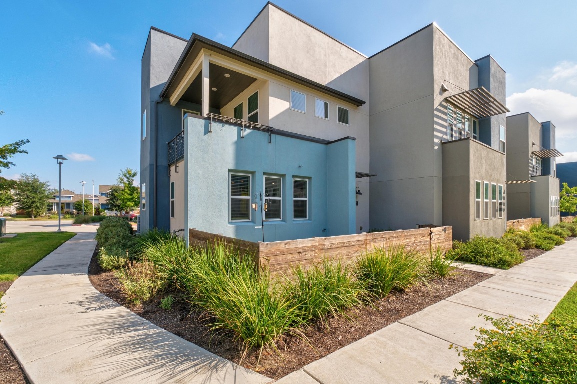 9015 Cattle Baron Path, Unit 1905 Austin, TX 78747 - Photo 2 of 40 a front view of a house with a yard