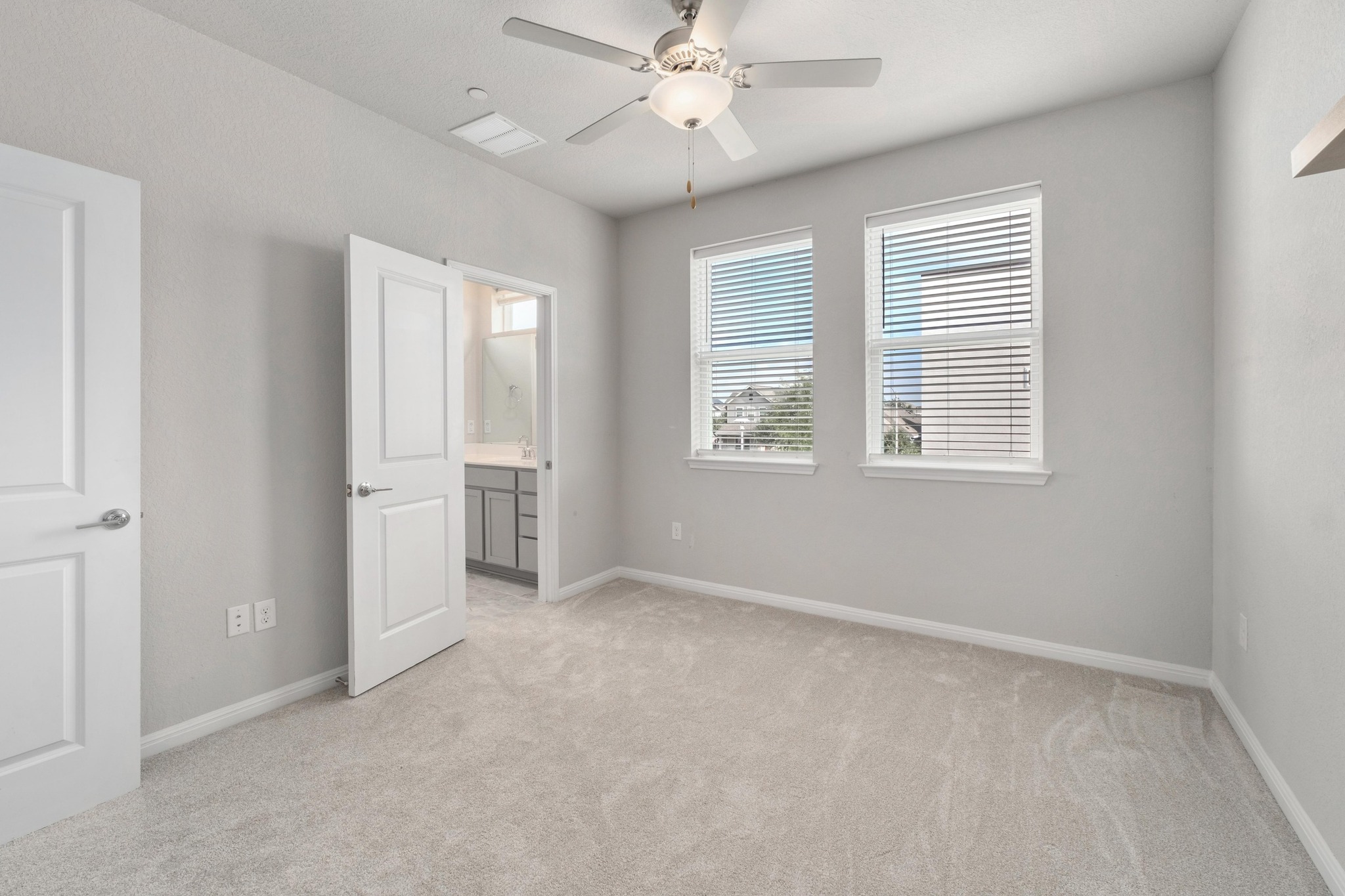 9015 Cattle Baron Path, Unit 1905 Austin, TX 78747 - Photo 21 of 40 an empty room with windows and fan