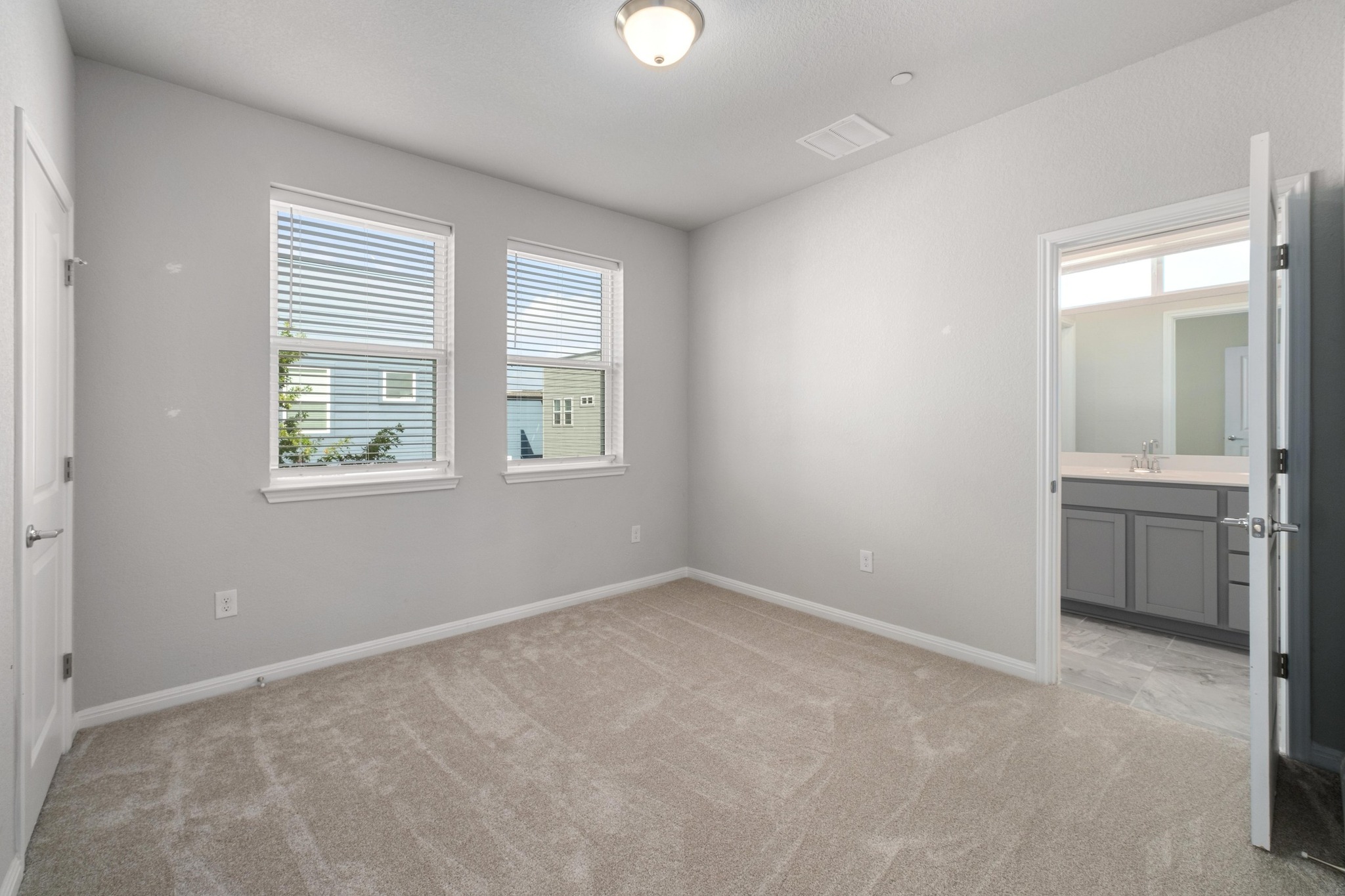 9015 Cattle Baron Path, Unit 1905 Austin, TX 78747 - Photo 22 of 40 an empty room with windows and closet