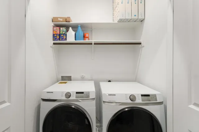 an aerial view of residential building and parking