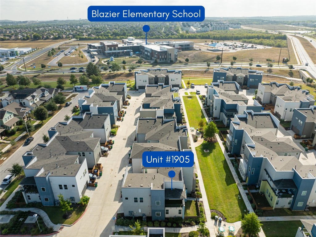 9015 Cattle Baron Path, Unit 1905 Austin, TX 78747 - Photo 25 of 40 an aerial view of residential building and parking