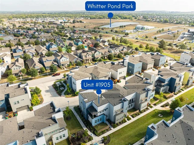 a sitting area with pool and bench