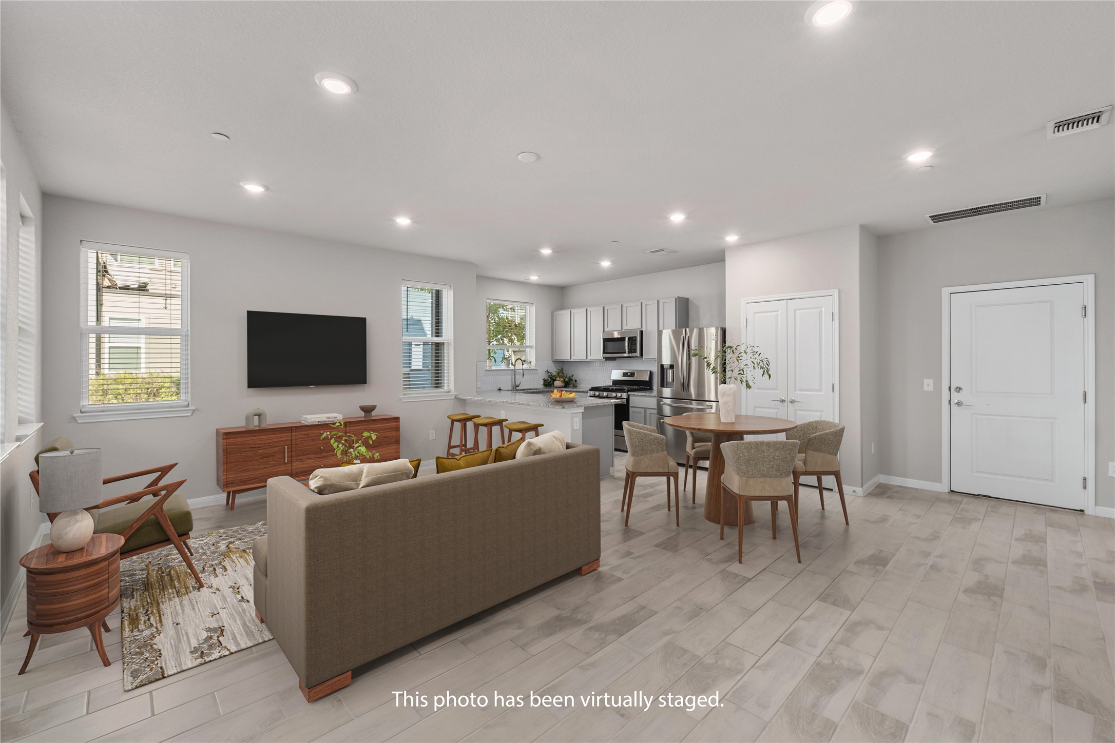 9015 Cattle Baron Path, Unit 1905 Austin, TX 78747 - Photo 5 of 40 a living room with furniture and a flat screen tv