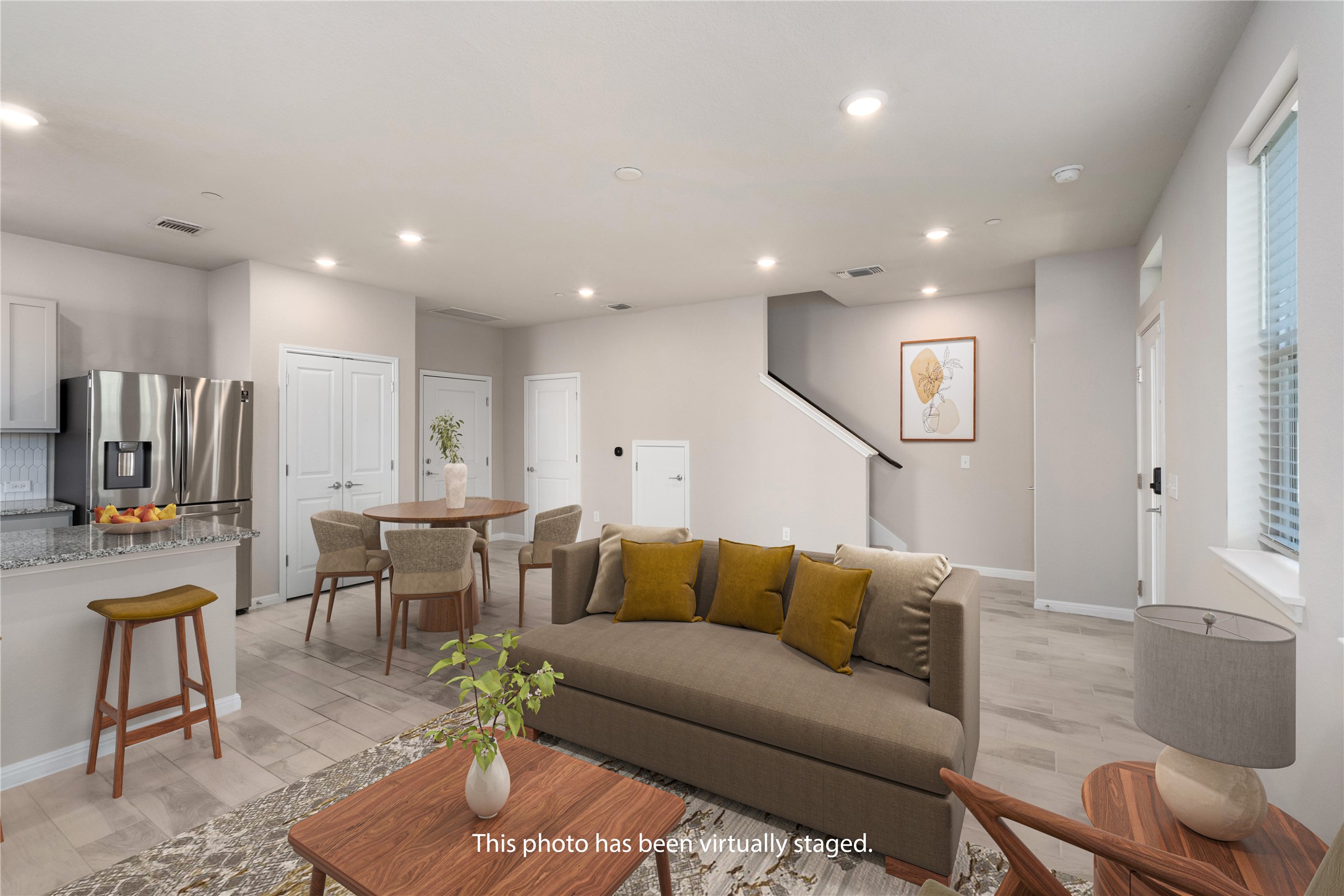 9015 Cattle Baron Path, Unit 1905 Austin, TX 78747 - Photo 9 of 40 a living room with furniture kitchen view and a large window