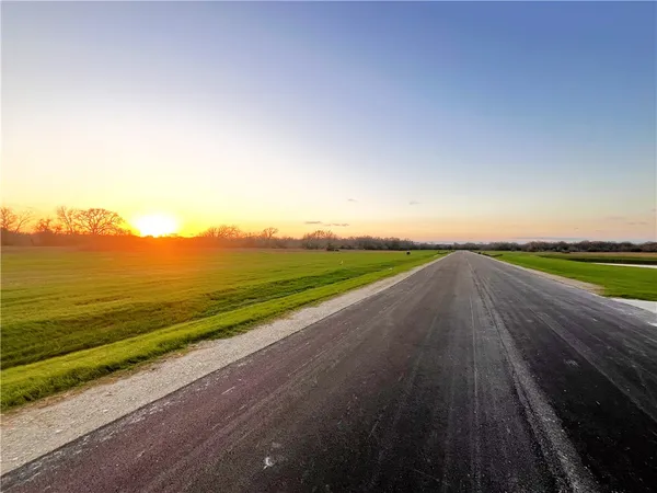 a view of a lake with a big yard