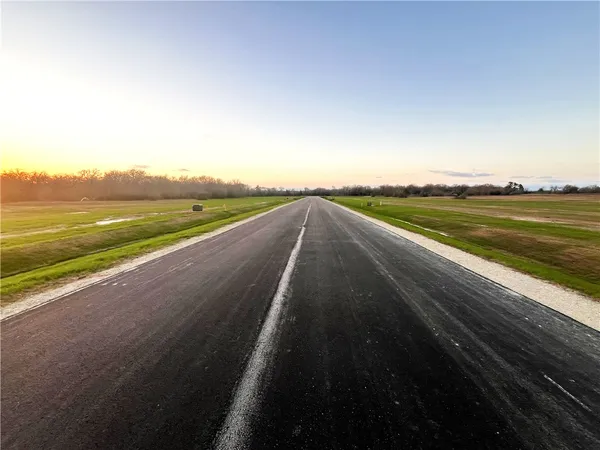 a view of a house with backyard porch and sitting area
