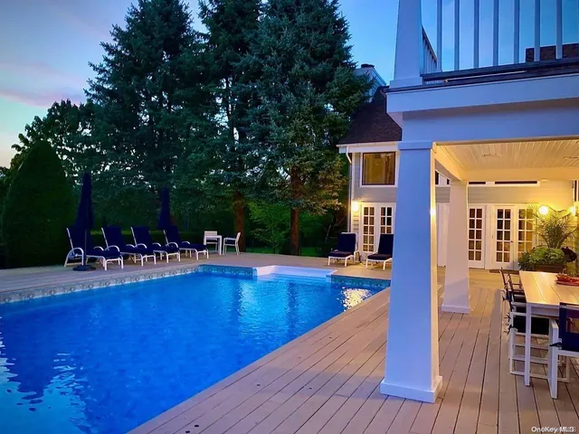a view of a swimming pool with seating space